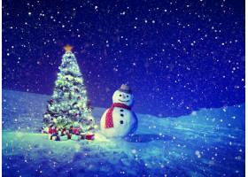 雪人和松树在圣诞节加速降雪图片